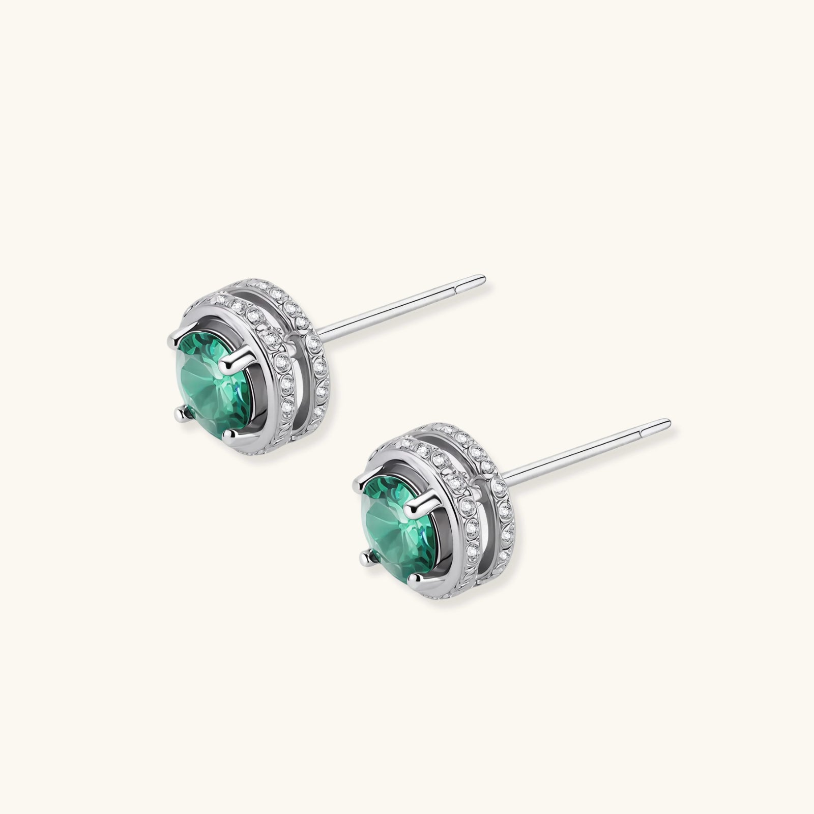 Round green moissanite stud earrings in sterling silver halo settings with brilliant sparkle on white background.